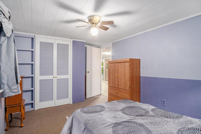 4468 Teal Ln, Newaygo, MI 49337 - bedroom featuring carpet, a closet, ornamental molding, and a ceiling fan