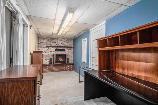 4468 Teal Ln, Newaygo, MI 49337 - unfurnished office with a drop ceiling, carpet floors, and a fireplace
