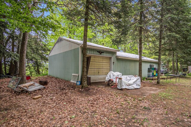 4468 Teal Ln, Newaygo, MI 49337 - view of side of property featuring a garage and an outdoor structure