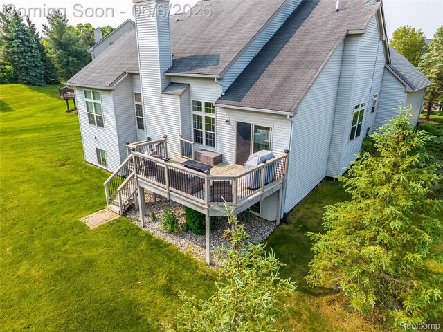 2327 Cherry Tree Ln, Grand Blanc, MI 48439 - back of house with roof with shingles, a yard, a chimney, and a wooden deck