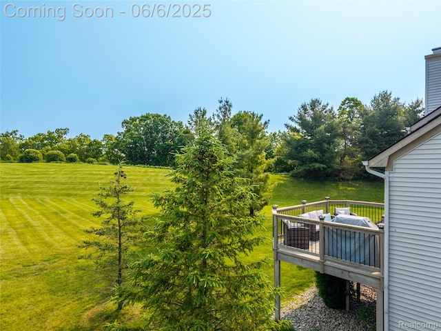 2327 Cherry Tree Ln, Grand Blanc, MI 48439 - view of green lawn featuring a deck and view of wooded area