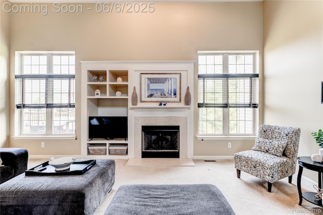 2327 Cherry Tree Ln, Grand Blanc, MI 48439 - carpeted living room featuring baseboards, healthy amount of natural light, and a fireplace