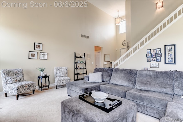 2327 Cherry Tree Ln, Grand Blanc, MI 48439 - carpeted living area with stairway, baseboards, and a high ceiling