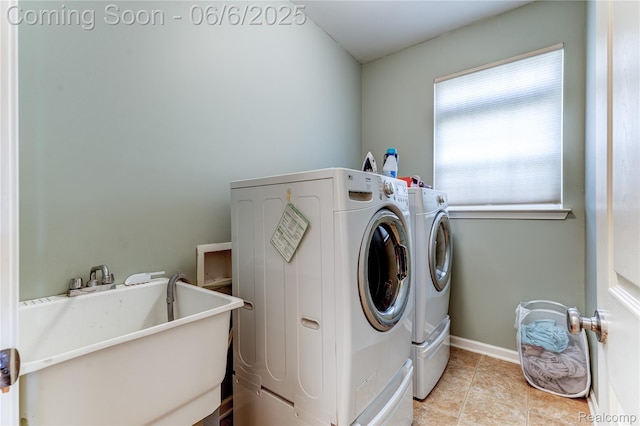 2327 Cherry Tree Ln, Grand Blanc, MI 48439 - washroom featuring washing machine and dryer, light tile patterned floors, and baseboards