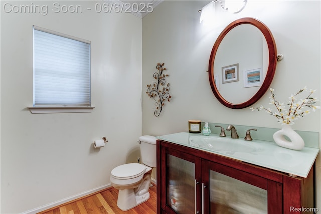 2327 Cherry Tree Ln, Grand Blanc, MI 48439 - half bathroom with wood finished floors, toilet, vanity, and baseboards