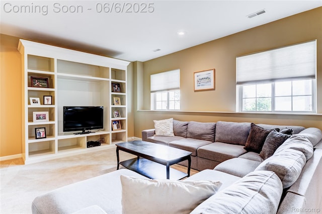 2327 Cherry Tree Ln, Grand Blanc, MI 48439 - living room featuring light carpet, baseboards, and built in shelves