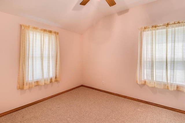 11883 Scott Park Rd, Delton, MI 49046 - empty room featuring ceiling fan, carpet, lofted ceiling, and baseboards