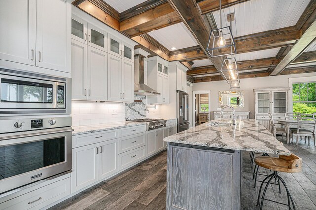 23772 Wilson Rd, Sturgis, MI 49091 - kitchen with stainless steel appliances, wall chimney exhaust hood, a sink, coffered ceiling, and dark wood finished floors