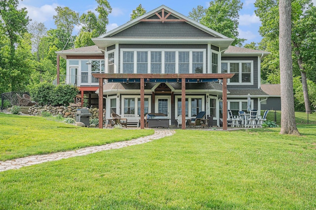 23772 Wilson Rd, Sturgis, MI 49091 - rear view of property with a yard, a patio area, a sunroom, and a shingled roof