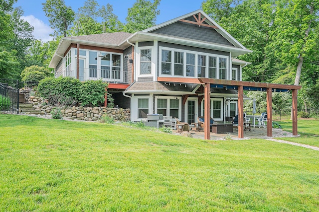 23772 Wilson Rd, Sturgis, MI 49091 - back of property featuring a sunroom, a patio area, a yard, and a shingled roof