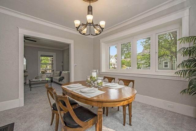 659 Fuller Ave SE, Grand Rapids, MI 49506 - carpeted dining room with a chandelier, ornamental molding, and baseboards