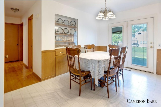 5053 Jonfield Ave SE, Grand Rapids, MI 49548 - dining space featuring a chandelier and light floors