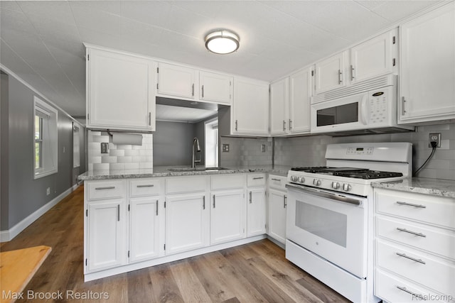 6593 Sherman Dr, Otter Lake, MI 48464 - kitchen with white appliances, a sink, white cabinetry, wood finished floors, and light stone countertops