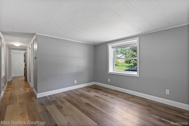 6593 Sherman Dr, Otter Lake, MI 48464 - empty room with wood finished floors and baseboards