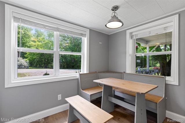 6593 Sherman Dr, Otter Lake, MI 48464 - dining room featuring healthy amount of natural light, wood finished floors, baseboards, and ornamental molding