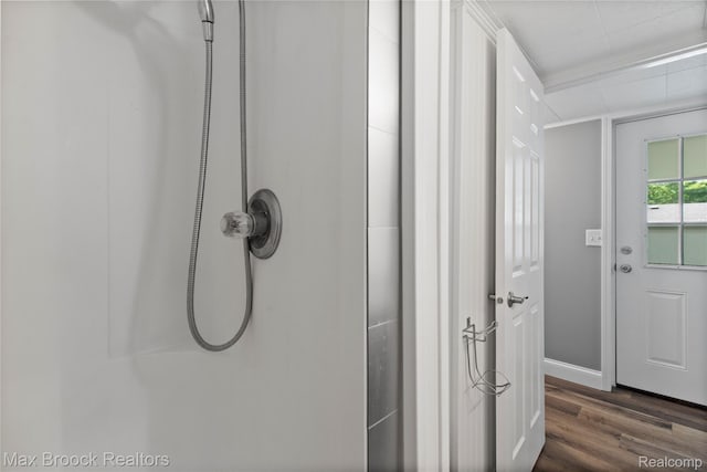 6593 Sherman Dr, Otter Lake, MI 48464 - bathroom view of wood finished floors, a shower, and baseboards