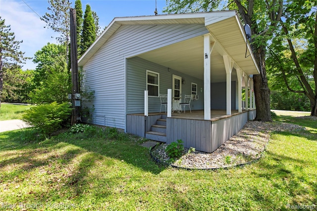 6593 Sherman Dr, Otter Lake, MI 48464 - view of home's exterior with a lawn and covered porch