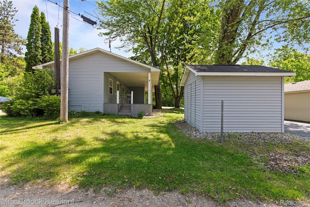 6593 Sherman Dr, Otter Lake, MI 48464 - rear view of property featuring a lawn