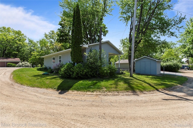 6593 Sherman Dr, Otter Lake, MI 48464 - view of side of home with a lawn