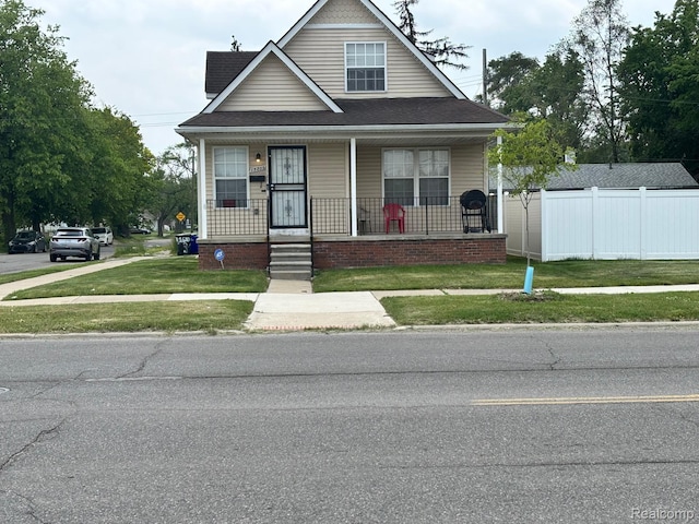 15803 Tireman St, Detroit, MI 48228 - bungalow-style house featuring a porch and roof with shingles