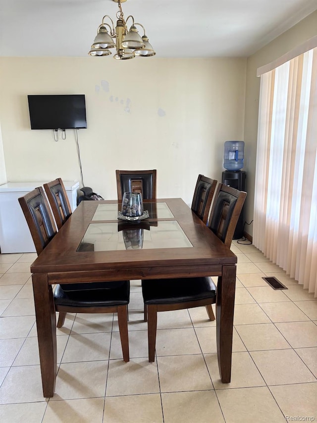 15803 Tireman St, Detroit, MI 48228 - dining area featuring a chandelier and light tile patterned floors