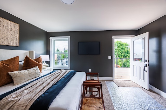215 W Fifth Ave Unit 2, Flint, MI 48502 - bedroom featuring access to exterior and carpet