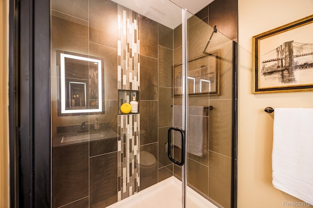 215 W Fifth Ave Unit 2, Flint, MI 48502 - bathroom with a stall shower and vanity
