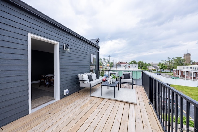 215 W Fifth Ave Unit 2, Flint, MI 48502 - wooden deck featuring an outdoor hangout area