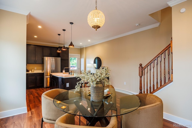 215 W Fifth Ave Unit 2, Flint, MI 48502 - dining room featuring dark wood-style floors, ornamental molding, stairway, recessed lighting, and a chandelier