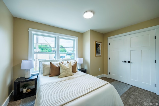 215 W Fifth Ave Unit 2, Flint, MI 48502 - carpeted bedroom with baseboards and a closet