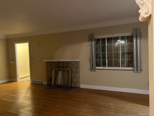 18815 Lancashire St, Detroit, MI 48223 - unfurnished living room with ornamental molding, wood finished floors, baseboards, and a fireplace