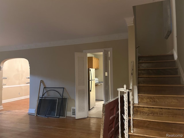18815 Lancashire St, Detroit, MI 48223 - stairway featuring wood finished floors, baseboards, ornamental molding, and arched walkways