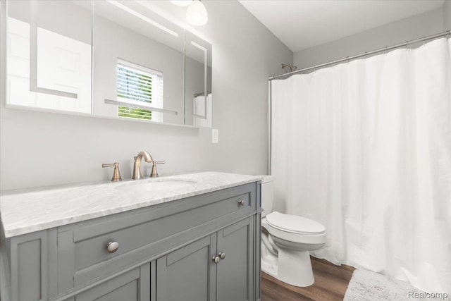 2230 Briar Rdg, Wolverine Lake, MI 48390 - full bath with vanity, toilet, wood finished floors, and a shower with curtain
