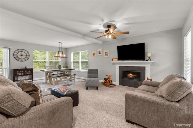 2230 Briar Rdg, Wolverine Lake, MI 48390 - carpeted living room with a lit fireplace, ceiling fan, baseboards, and a chandelier