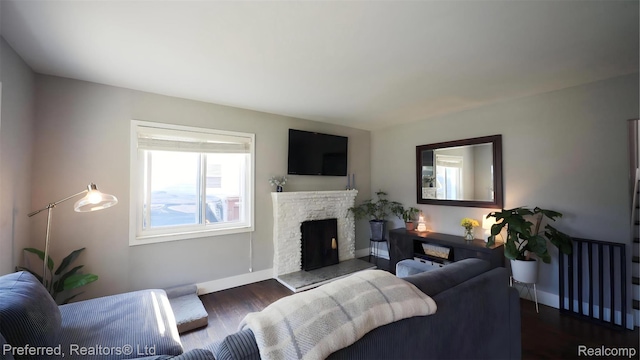 8483 Harding, Center Line, MI 48015 - living room featuring wood finished floors, baseboards, and a stone fireplace