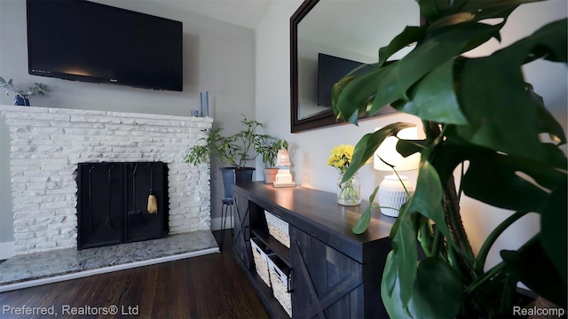 8483 Harding, Center Line, MI 48015 - living room featuring wood finished floors and a brick fireplace