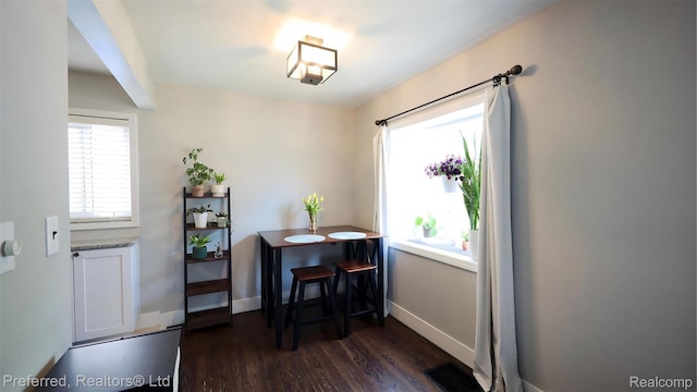 8483 Harding, Center Line, MI 48015 - dining area with dark wood-style floors and baseboards