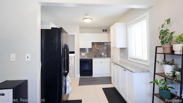 8483 Harding, Center Line, MI 48015 - kitchen featuring black appliances, a sink, decorative backsplash, white cabinets, and light stone counters