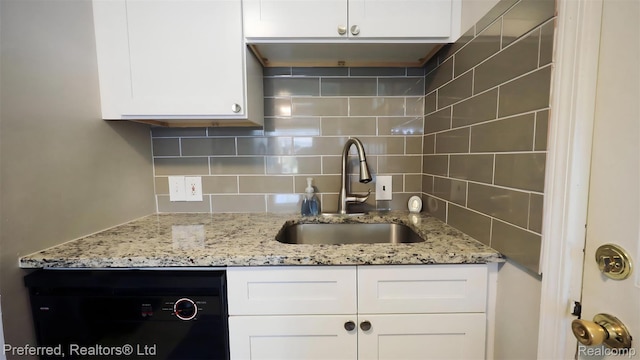 8483 Harding, Center Line, MI 48015 - kitchen featuring a sink, white cabinetry, tasteful backsplash, and light stone countertops