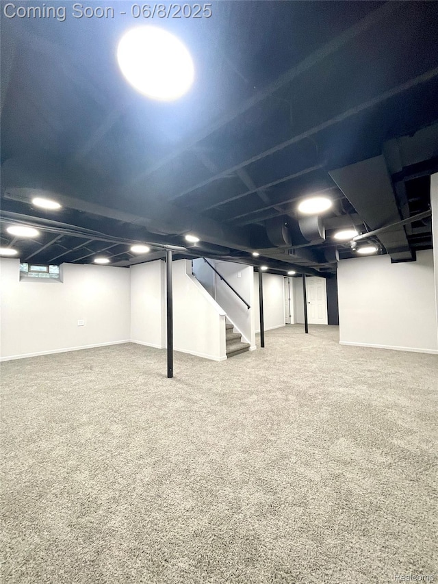 1311 12th St, Wyandotte, MI 48192 - finished basement with stairway, carpet floors, and baseboards