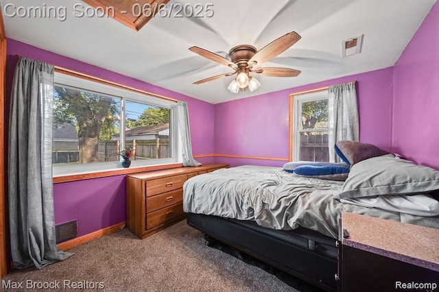 7713 Jackson St, Taylor, MI 48180 - bedroom with multiple windows, carpet floors, and a ceiling fan