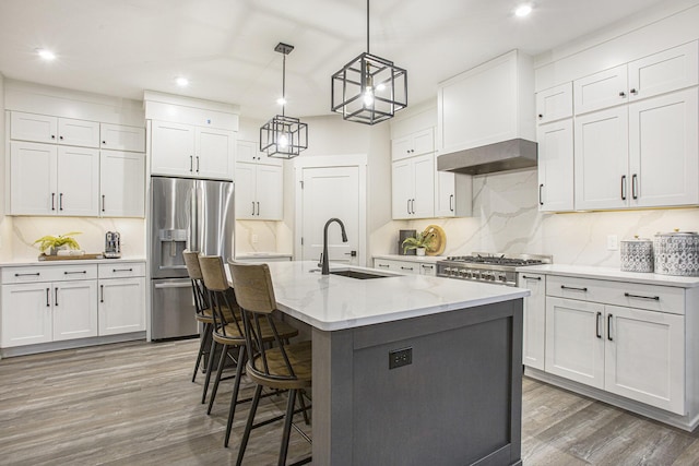 2748 Woodhaven Ct SW Unit 03, Byron Center, MI 49315 - kitchen with stainless steel fridge with ice dispenser, a sink, light wood finished floors, tasteful backsplash, and recessed lighting