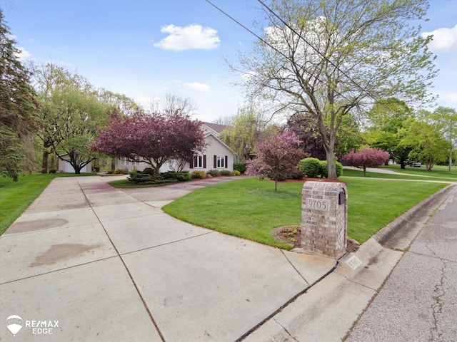 9705 Burning Tree Dr, Grand Blanc, MI 48439 - obstructed view of property with a front lawn