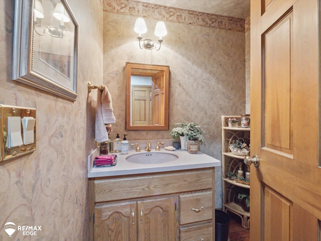 9705 Burning Tree Dr, Grand Blanc, MI 48439 - bathroom featuring wallpapered walls and vanity