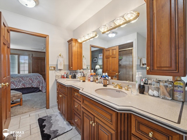 9705 Burning Tree Dr, Grand Blanc, MI 48439 - full bathroom with double vanity, a shower stall, ensuite bathroom, and tile patterned flooring