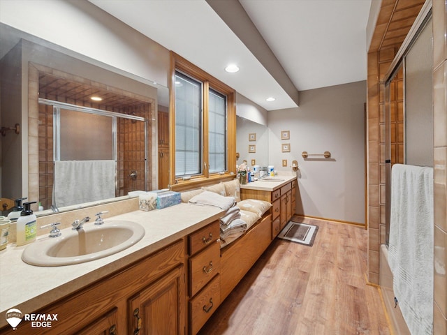 9705 Burning Tree Dr, Grand Blanc, MI 48439 - full bathroom with a stall shower, vanity, wood finished floors, and recessed lighting