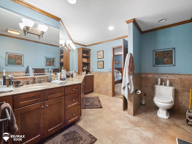9705 Burning Tree Dr, Grand Blanc, MI 48439 - full bath featuring tile walls, ornamental molding, wainscoting, a chandelier, and ensuite bath