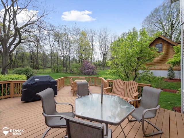 9705 Burning Tree Dr, Grand Blanc, MI 48439 - deck with outdoor dining space and a grill