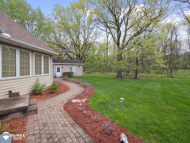 9705 Burning Tree Dr, Grand Blanc, MI 48439 - view of grassy yard with an outdoor structure