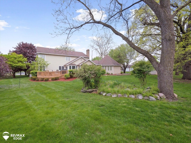 9705 Burning Tree Dr, Grand Blanc, MI 48439 - view of grassy yard featuring a deck